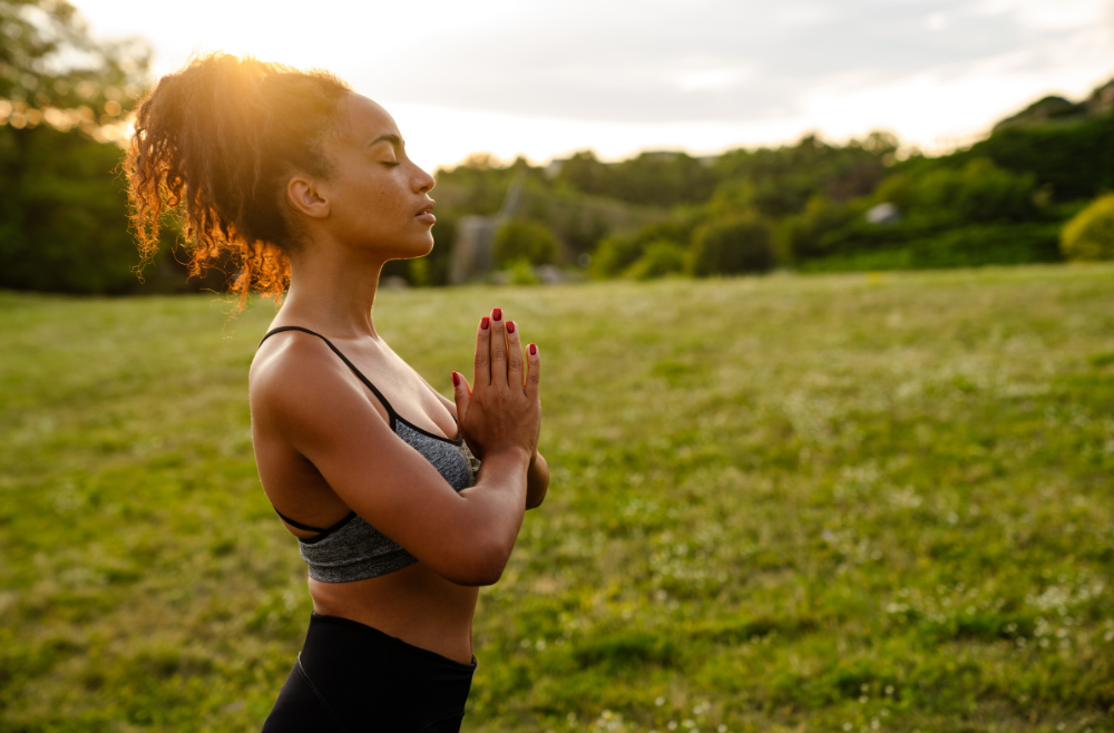 black mom meditating for self care